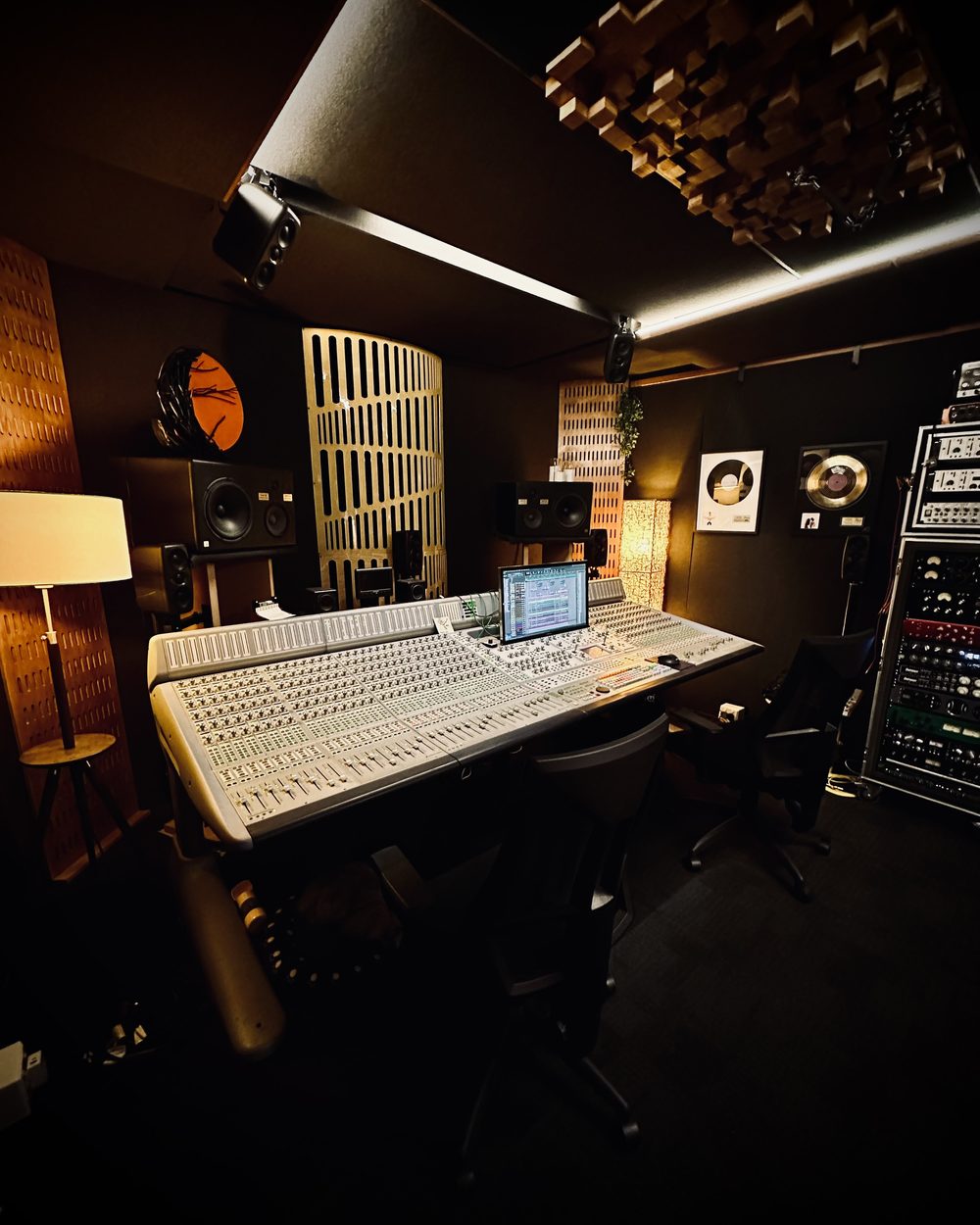 Studio B mix room with the 48-channel Avid D-Control, ceiling-mounted Atmos speakers and outboard racks at The Avenue Recording Studio, Cheltenham Melbourne